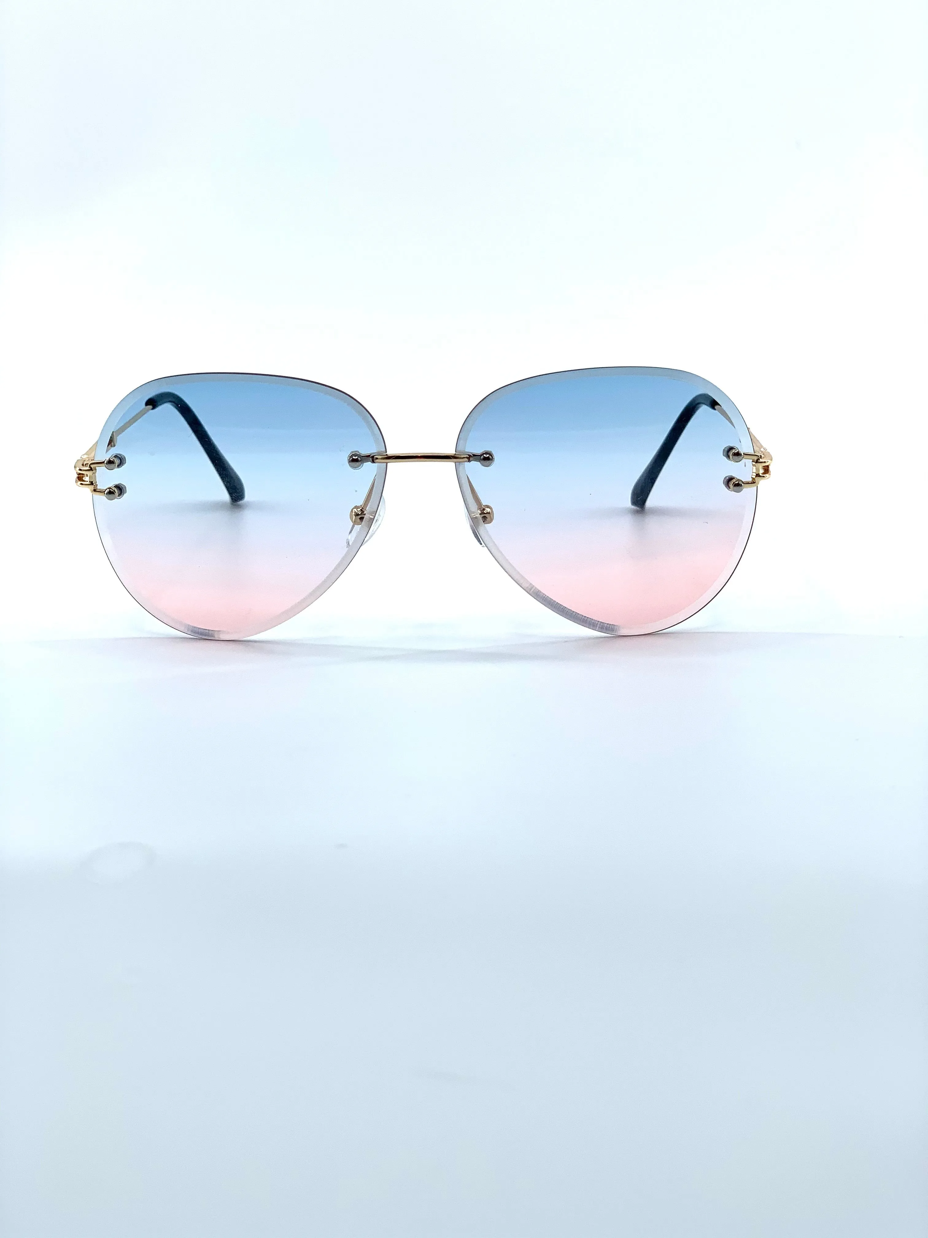 Oversized rimless blue and pink gradient aviators